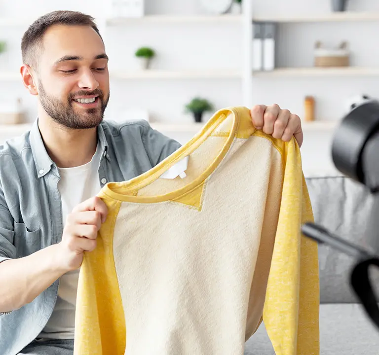 Social influencer showing new clothing brand to followers