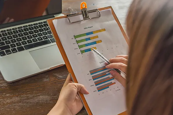 Agency team member going through project checklist